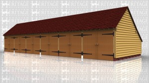 This oak framed garage building is formed of six bays, all are enclosed and accessed via garage doors to the front. There is an enclosed logstore to the rear of the building.