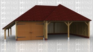 This building is a two bay oak framed open fronted garage with hipped ends with a single bay garage garage with log store on the left hand side. The single garage has garage doors on the front.