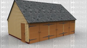 This oak framed three bay garage has enclosed bays, with the end bay separated from the others by an internal wall, so this bay could be used for storage or as a workshop. All two bays have garage doors to the front and the two side bays each have a single door to the side for access. There is also a three pane window on the enclosed bay.