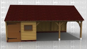 This is an oak framed garage building with two open bays used for parking and another bay which is enclosed and can be accessed via the wide door at the front. There is also a mullion window to the front of the building.