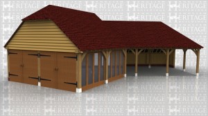 An oak framed building in a dog-leg shape with one section open with 2 bays for parking whilst the other end enclosed with two large doors, full height glazing along one side and an upper floor area accessed via an internal staircase.