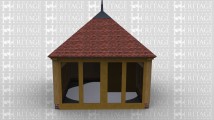 A single bay oak framed building with full height galzing on one wall and a steel finial on the top.