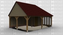 A 2 bay oak framed building open on the left and at the front with an internal partition including a door. The right wall has a 4 pane section of full height glazing to allow plenty of natural light into the building.