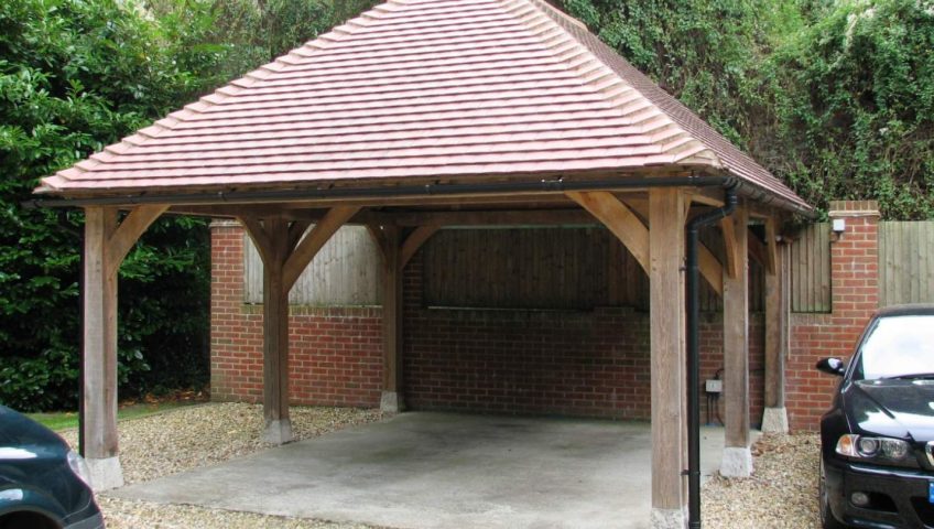 An oak carport at a shaded country property
